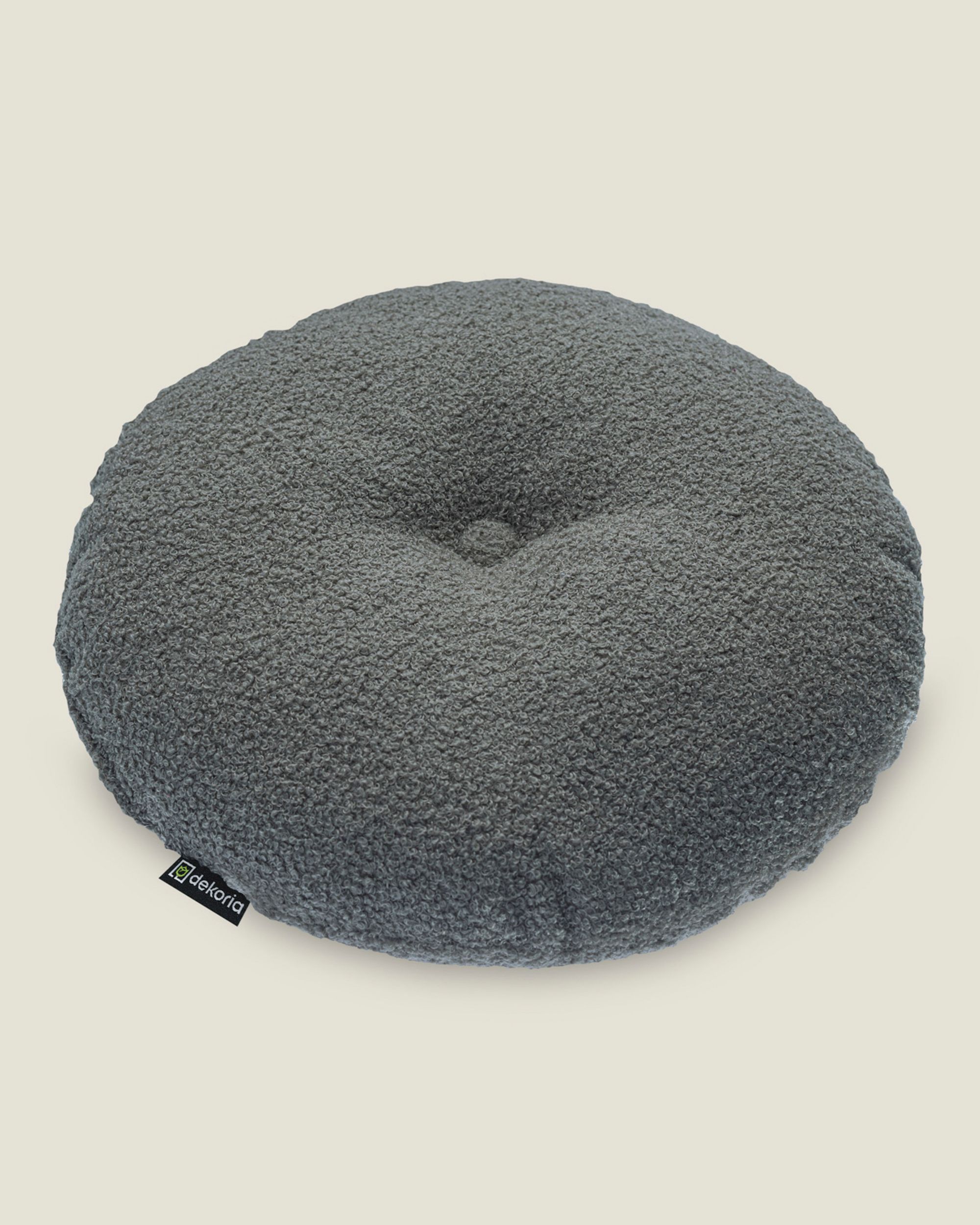 Round pillow with button colour grey fabric structured